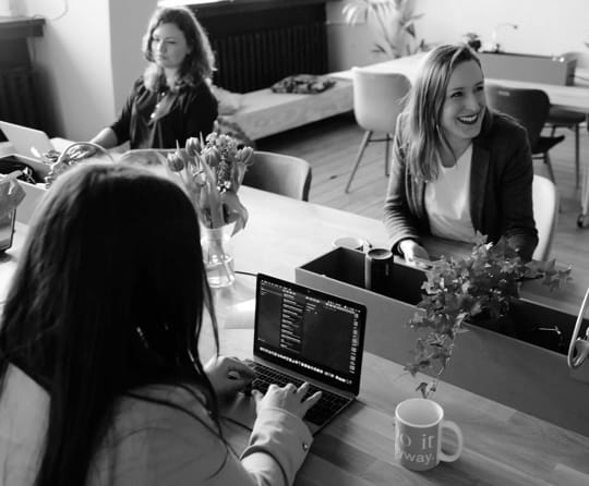 image of ladies working and laughing