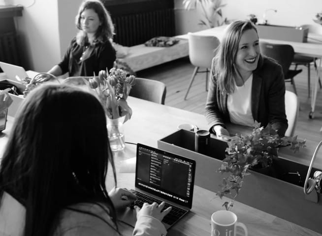 image of ladies working and laughing